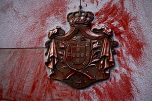 Melbourne, Australia: red dye is smeared over a coat of arms at the British consulate during an anti-monarchy protest
