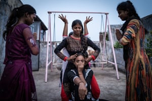 Roshni, 17; Suman, 21; Nandini, 19; Radhika, 15; and Suhani, 15, rehearse a dance routine on the roof of Roy’s home.