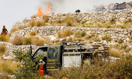 Firefighters battle a blaze in Ragusa, Sicily