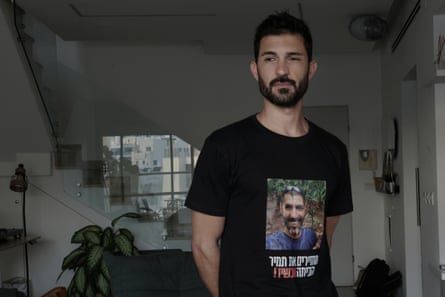 Nir wearing a T-shirt with his brother's face on it