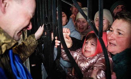 A man, a young girl and a woman crying.