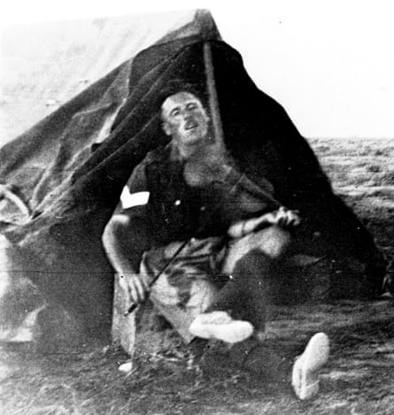 Tommy playing his violin during his time in the Western Desert, Egypt, 1940-1943