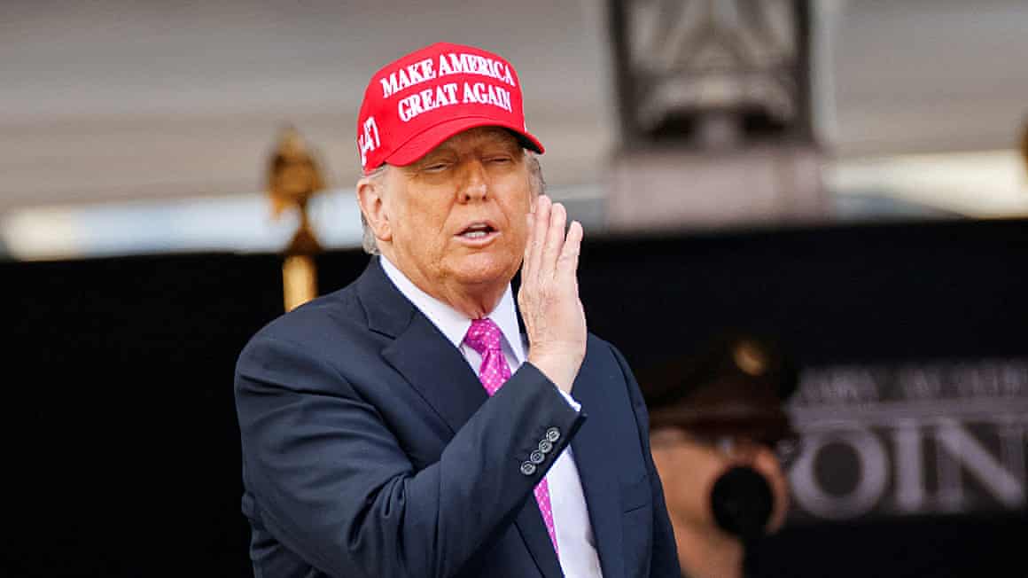 Donald Trump wears a ‘Make America Great Again’ hat at a military ceremony in New York.