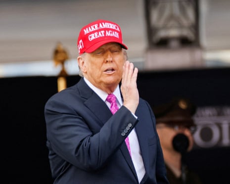 Donald Trump wears a ‘Make America Great Again’ hat at a military ceremony in New York.
