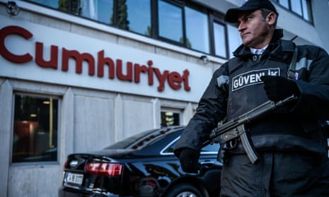 A security guard stands outside Cumhuriyet’s headquarters in Istanbul.