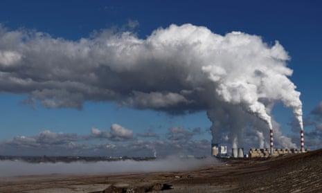 Bełchatów power station in Poland emitting clouds of white smoke and water vapour