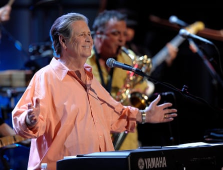 man wearing salmon-colored button-down