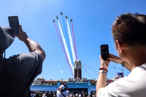 People take photos of jets with coloured jet streams