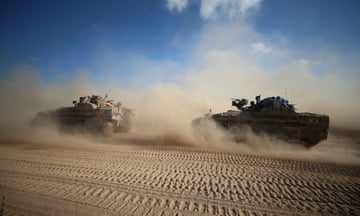 Israeli troops are seen near the border with Gaza, in southern Israel. The Israeli army announced on Wednesday that it has gained full operational control of the Philadelphi Corridor.