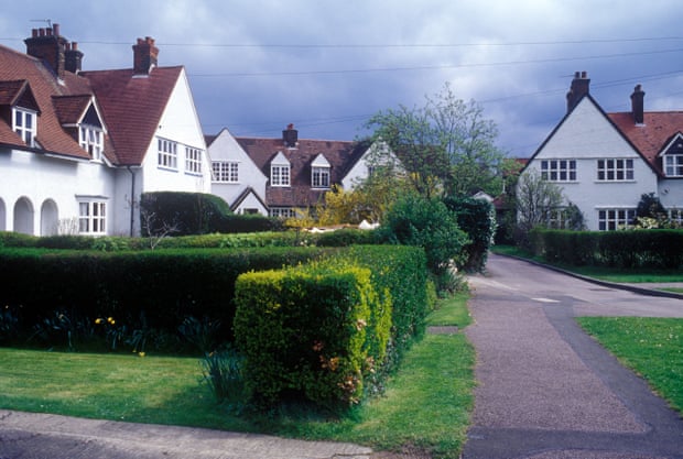 Arts and crafts houses in Letchworth, painted white with neatly trimmed hedges