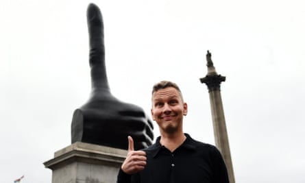 David Shrigley poses for photos in front of his seven-metre high sculpture Really Good.