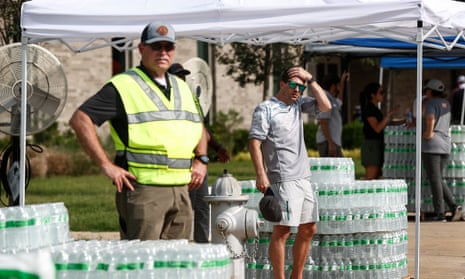 People hand out bottled water on Monday in Germantown, Tennessee.