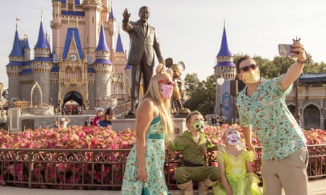 Guests take a selfie at Magic Kingdom Park at Walt Disney World Resort.