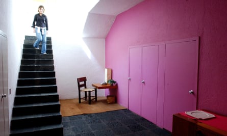 A visitor descends a staircase on a tour of architect Luis Barragan’s home in Mexico City.