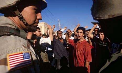US soldiers and Baghdad residents, Iraq, May 2003.