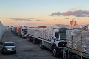 A line of lorries piled high with boxes