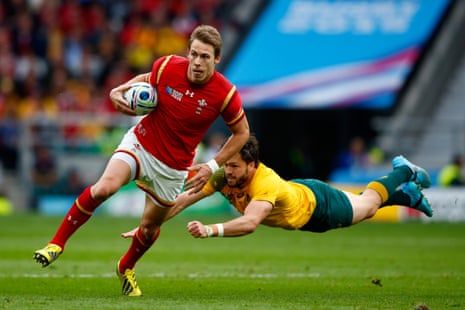 Liam Williams of Wales evades a tackle by Adam Ashley-Cooper.