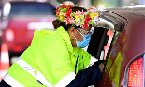 A nurse vaccinates a member of the public during a Cook Islands drive through vaccination community event in Auckland, New Zealand.