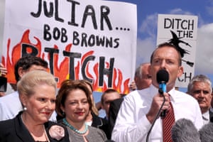 Tony Abbott speaks at an anti-carbon tax rally in front of banners attacking Julia Gillard, 23 March 2011