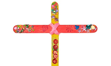 Photograph of two lolly sticks in shape of a cross decorated with beads and hearts