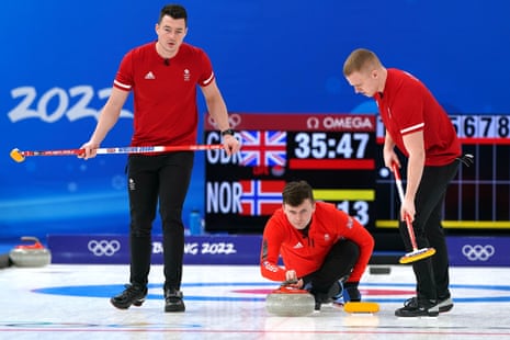 Great Britain’s Bruce Mouat (centre) in action as Hammy McMillan (left) and Bobby Lammie sweep the ice.