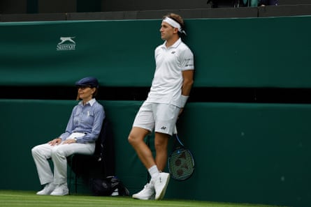 Norway’s Casper Ruud rests at the side of the court at Wimbledon.