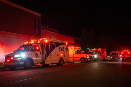 Ambulances parked up at night at a hospital