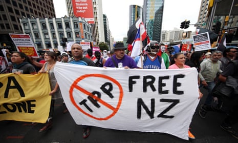 Protesters march to the venue of the Trans Pacific Partnership agreement signing in Auckland on Thursday.