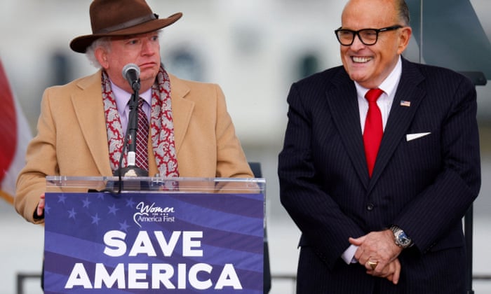 Attorney John Eastman (left) speaks next to then-president Donald Trump's personal attorney Rudy Giuliani, as Trump supporters gather ahead of the president’s speech to claim that Joe Biden did not beat him to the presidency, in Washington, DC, on January 6, 2021, shortly before Trump urged the crowd to march to the US Capitol, where the mob invaded to try to stop Congress certifying Biden’s win.