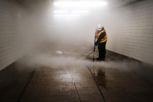 Workers clean a subway station in Brooklyn as New York City confronts the coronavirus outbreak on March 11, 2020 in New York City. President Donald Trump announced on Wednesday evening that he is restricting passenger travel from 26 European nations to the U.S. in an effort to contain the coronavirus which is rapidly spreading throughout the world and America.