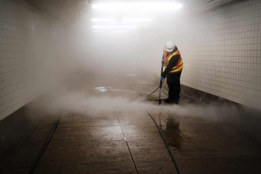 Workers clean a subway station in Brooklyn as New York City confronts the coronavirus outbreak on March 11, 2020 in New York City.