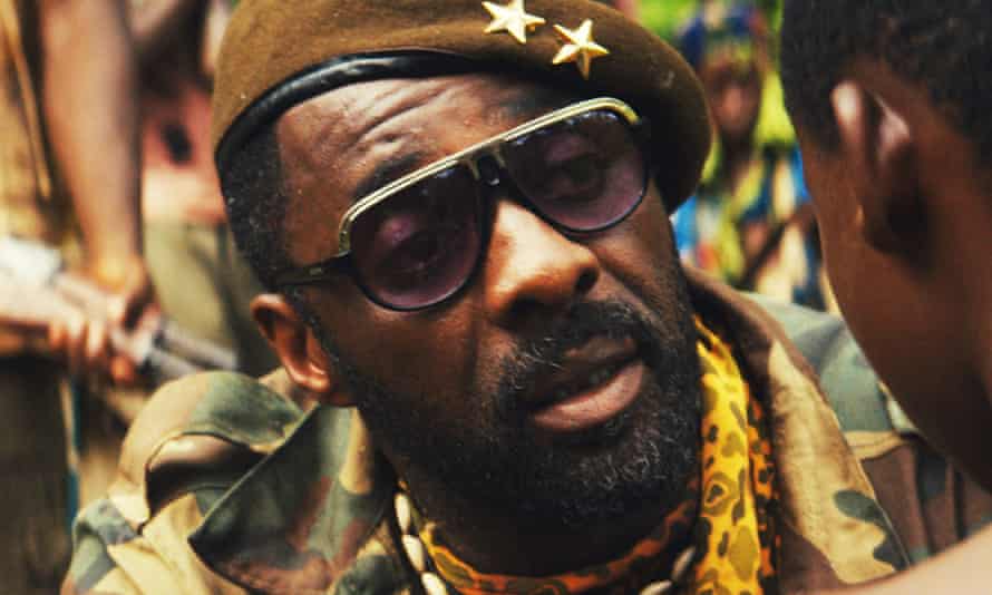 Idris Elba in dark glasses and a cap in Beasts of No Nation.