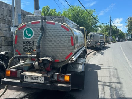 Two lorries parked on side of road