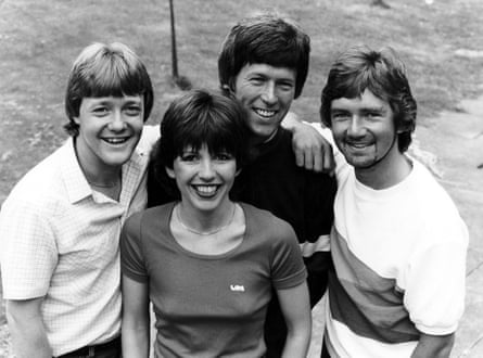 A black and white photo of Swap Shop presenters Keith Chegwin, Maggie Philbin, John Craven and Noel Edmonds.