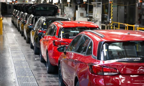 A line of cars on a car assembly line at the Vauxhall car factory in Ellesmere Port, Wirral.