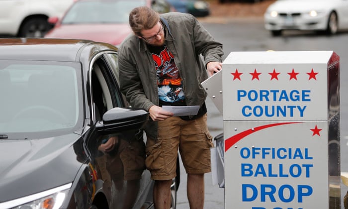 Ian Marshall of Kent, Ohio casts his ballot at a ballot drop box during Ohio’s early voting period.