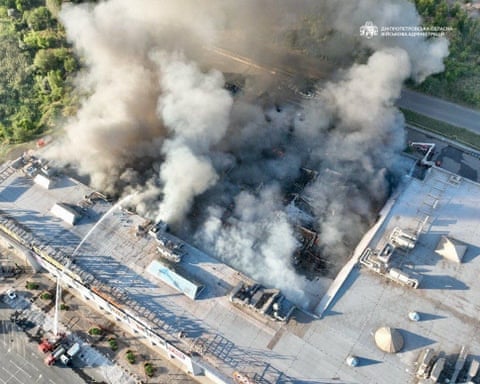 Aerial view of firefighters at work at the shopping mall hit by Russian drones in Kryvyi Rih, central Ukraine