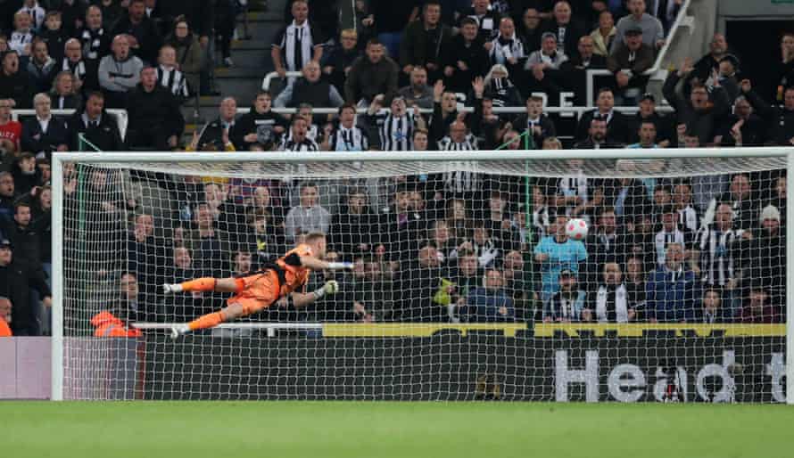 Arsenal’s keeper Aaron Ramsdale is relieved to see Newcastle United’s Callum Wilson shot whizz just wide of the upright.