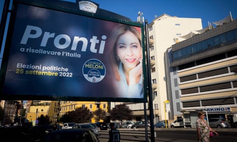 Pedestrians in Rome walk past an election poster for Giorgia Meloni, far-right leader of the Brothers of Italy.