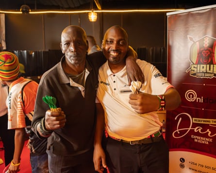 Peter Wachiuri and James Kamama pose for a photo.