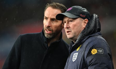 Gareth Southgate looks on against Belgium with Steve Holland, his assistant.