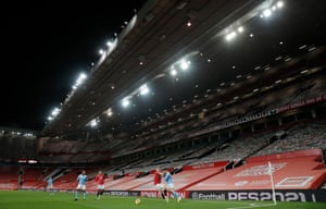 Manchester City’s João Cancelo takes on Manchester United’s Scott McTominay in front of the empty Sir Alex Ferguson stand at Old Trafford on 12 December.