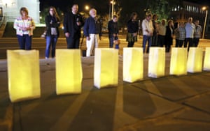People stand in front of illuminations on the steps of Greene Memorial United Methodist Church in Roanoke, Virginia