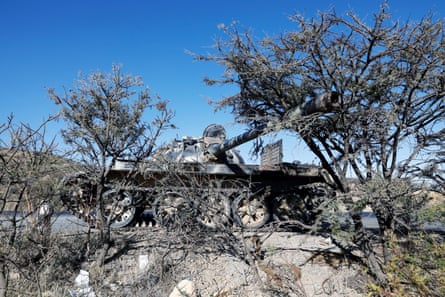 A damaged Eritrean military tank behind some trees near the town of Wikro, Ethiopia