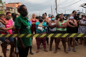 Residents wait for food donations in Brasilândia, São Paulo.