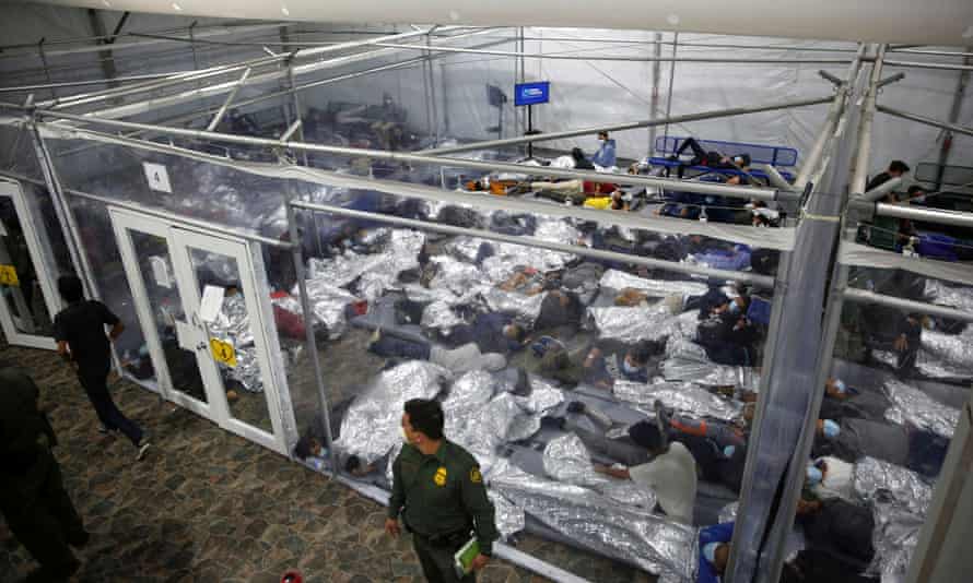 Migrant children rest inside a pod in the Donna Department of Homeland Security holding facility, the main detention center for unaccompanied children in the Rio Grande Valley run by the US Customs and Border Protection in Donna, Texas, 30 March 2021.