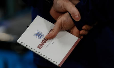 Steve Holland, England's assistant manager, holds his tactics notebook just before kick-off for the last-16 win against Senegal.