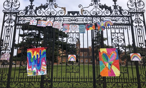 Homemade rainbow signs are displayed on the gates of Carew Academy school in Wallington during lockdown in April 2020.
