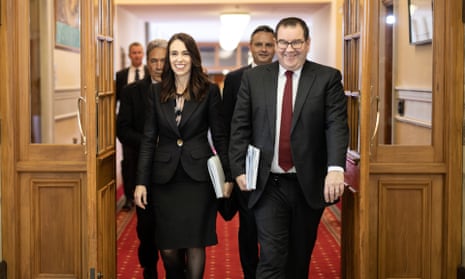 New Zealand’s PM Jacinda Ardern and finance minister, Grant Robertson, walk to the house of parliament on budget day. 