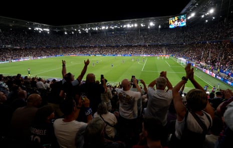 Fans celebrate in the stands after Brian Madjo of Aston Villa scores his team's first goal